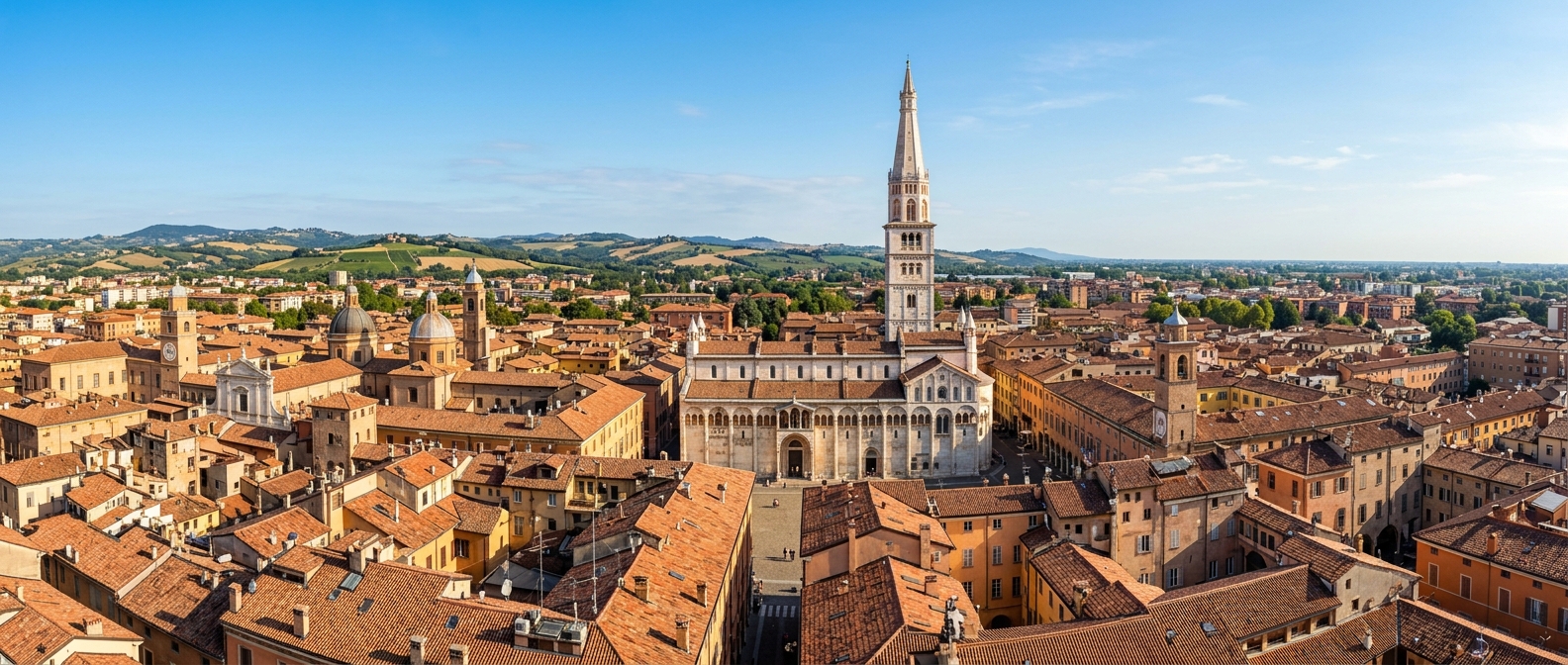 Panoramic view of Modena city skyline featuring the UNESCO World Heritage Romanesque cathedral and Ghirlandina tower, terracotta rooftops, Emilia-Romagna landscape, clear blue sky