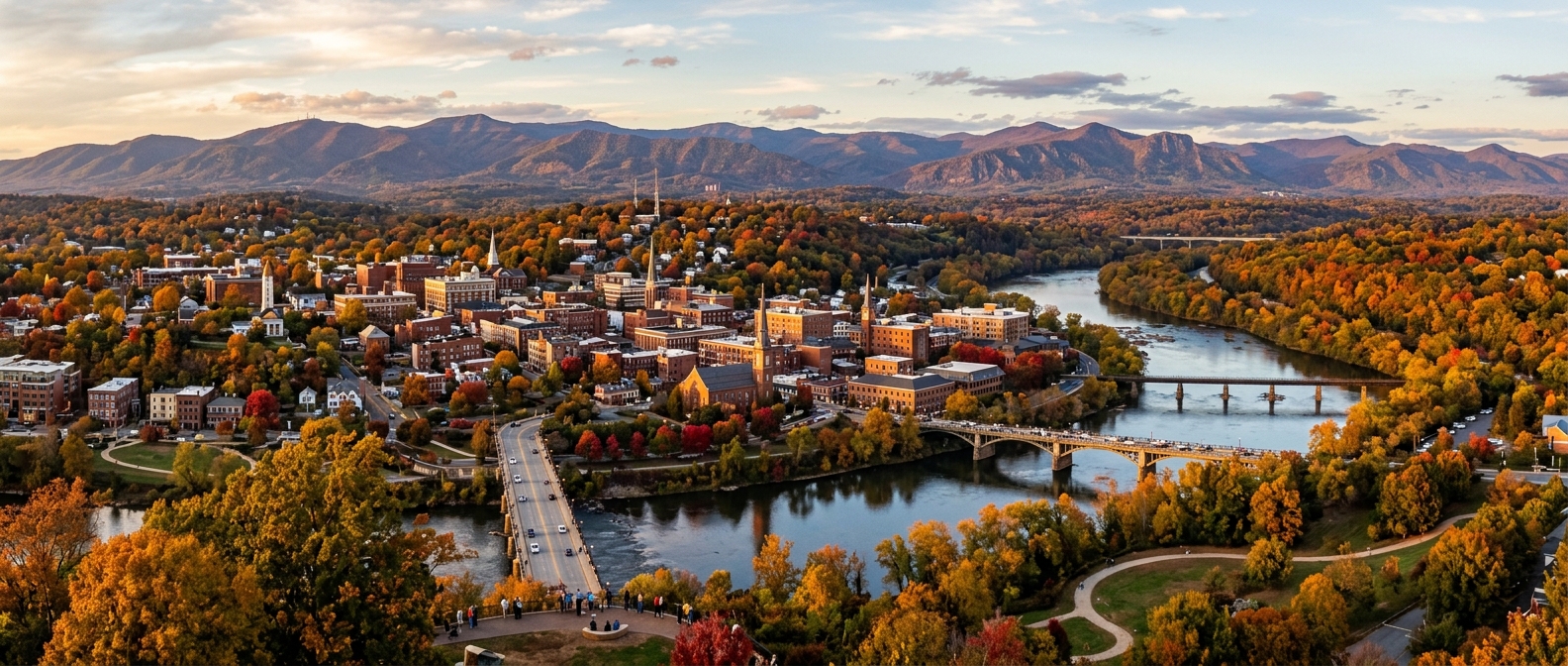 Panoramic view of Lynchburg Virginia skyline with Blue Ridge Mountains in background, James River flowing through the city, historic downtown buildings, autumn foliage
