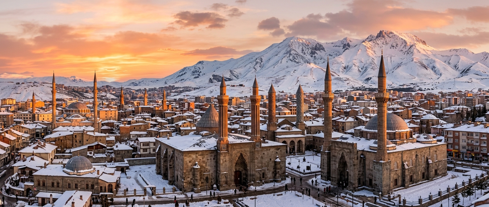 Panoramic view of Erzurum city skyline with historic mosques and minarets in foreground, snow-covered Palandoken Mountains in background, winter sunset glow, Eastern Anatolia landscape